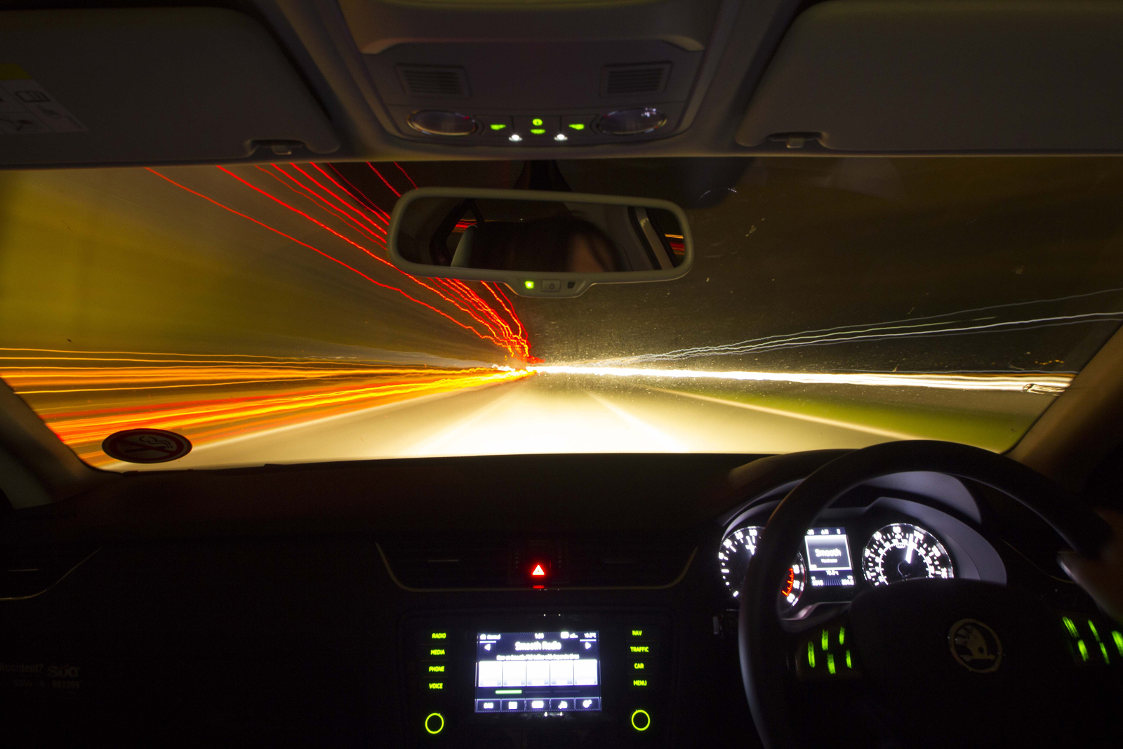 A car driving fast at night